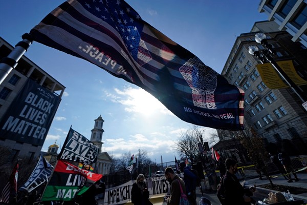 Flags fly in Black Lives Matter Plaza as President Joe Biden is sworn in during the 59th Presidential Inauguration, in Washington, Jan. 20, 2021 (AP photo by Gerald Herbert).