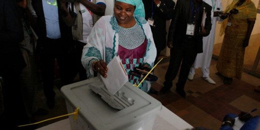 A woman casts her ballot during elections, in Niamey, Niger, Feb. 21, 2016 (AP photo by Gael Cogne).