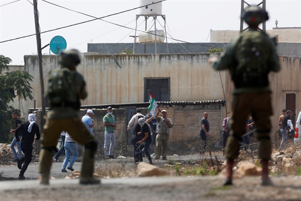 Israeli troops clash with Palestinian demonstrators following a weekly demonstration against Israeli Jewish settlements, in the West Bank village of Kafr Qaddum, Sept. 4, 2020 (AP photo by Majdi Mohammed).