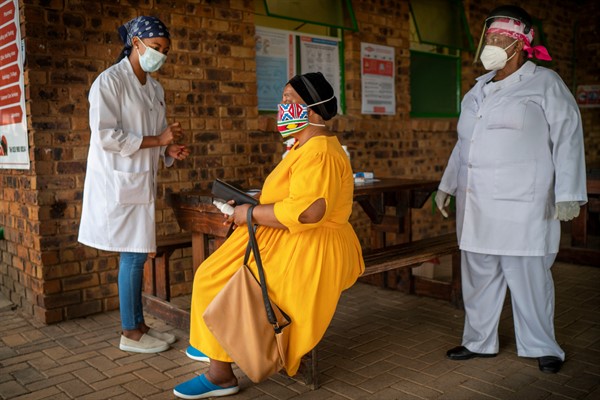 A woman is briefed before taking a COVID-19 test in Groblersdal, South Africa, Feb. 11, 2021 (AP photo by Jerome Delay).