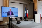 French President Emmanuel Macron, right, attends a videoconference meeting as U.S. President Joe Biden appears on a screen, Paris, Feb. 19, 2021 (pool photo by Benoit Tessier via AP Images).