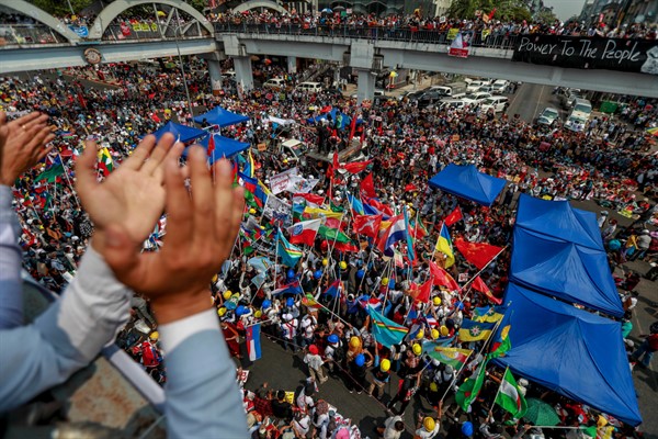 Demonstrators wave the flags of different ethnic groups during a protest against the military coup, in Yangon, Myanmar, Feb. 18, 2021 (AP Photo).