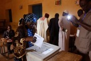 A woman casts her ballot during elections in Niamey, Niger, Feb. 21, 2016 (AP photo by Gael Cogne).