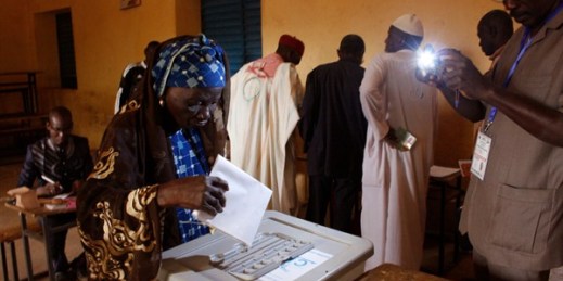 A woman casts her ballot during elections in Niamey, Niger, Feb. 21, 2016 (AP photo by Gael Cogne).