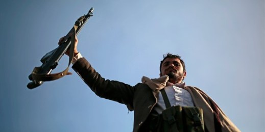 A Houthi supporter holds up his rifle during a demonstration against the United States over its decision to designate the Houthis as a foreign terrorist organization, in Sanaa, Yemen, Jan. 25, 2021 (AP photo by Hani Mohammed).