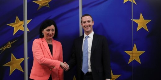 Facebook CEO Mark Zuckerberg, right, is greeted by European Commissioner for Values and Transparency Vera Jourova prior to a meeting at EU headquarters in Brussels, Feb. 17, 2020 (AP photo by Francisco Seco).