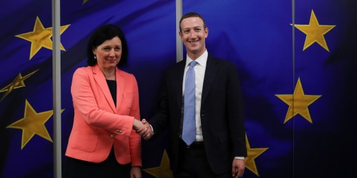 Facebook CEO Mark Zuckerberg, right, is greeted by European Commissioner for Values and Transparency Vera Jourova.