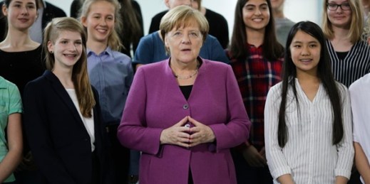 German Chancellor Angela Merkel with young women during an event on the eve of Girls’ Day, at the chancellery in Berlin, April 25, 2018 (AP photo by Markus Schreiber).