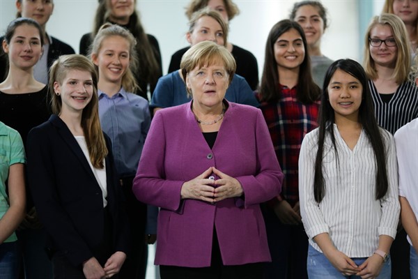 German Chancellor Angela Merkel with young women during an event on the eve of Girls’ Day, at the chancellery in Berlin, April 25, 2018 (AP photo by Markus Schreiber).