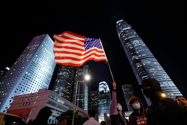 A protester with an American flag in Hong Kong, Nov. 28, 2019 (AP photo by Vincent Thian).