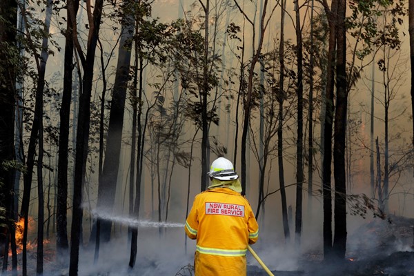 A firefighter manages a controlled burn near Tomerong, Australia, in an effort to contain a larger fire nearby, Jan. 8, 2020 (AP photo by Rick Rycroft).