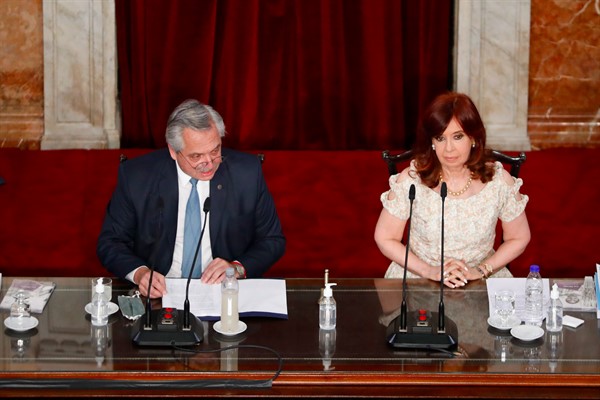 Argentine President Alberto Fernandez, seated beside Vice President Cristina Fernandez de Kirchner, delivers his State of the Nation speech to mark the opening session of Congress, in Buenos Aires, Argentina, March 1, 2021 (AP photo by Natacha Pisarenko).