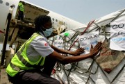 A shipment of COVID-19 vaccines distributed by the COVAX Facility arrives in Abidjan, Ivory Coast, Feb. 25, 2021 (AP photo by Diomande Ble Blonde).