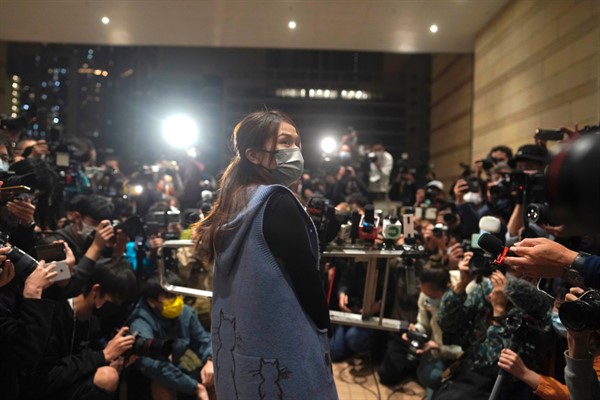 Clarisse Yeung, one of 47 pro-democracy advocates charged with “conspiracy to subvert state power,” speaks to the media after being released on bail at a court in Hong Kong, March 5, 2021 (AP photo by Kin Cheung).