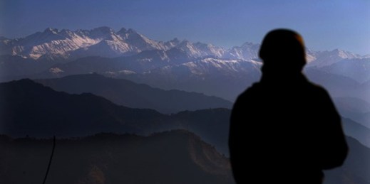 An Indian soldier looks toward the Pir Panjal mountain range from one of their forward posts at the Line of Control between India and Pakistan, Dec. 16, 2020 (AP photo by Channi Anand).