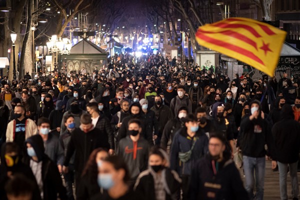 A protest condemning the arrest of rapper Pablo Hasel in Barcelona, Spain, Feb. 27, 2021 (AP photo by Emilio Morenatti).