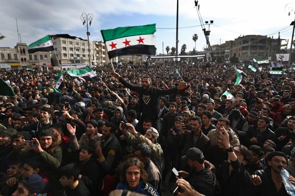 Thousands of anti-Syrian government protesters mark 10 years since the start of a popular uprising against President Bashar al-Assad’s rule, that later turned into an insurgency and civil war, in Idlib, Syria, March 15, 2021 (AP photo by Ghaith Alsayed).