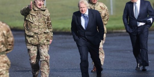 British Prime Minister Boris Johnson during a visit to Joint Helicopter Command Flying Station Aldergrove, Northern Ireland, March 12, 2021 (AP photo by Peter Morrison).