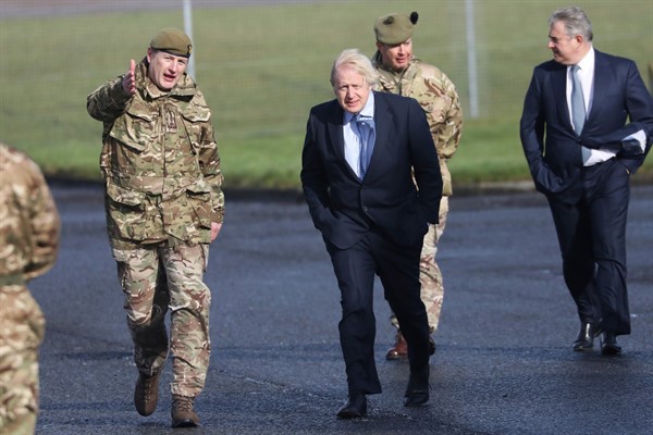 British Prime Minister Boris Johnson during a visit to Joint Helicopter Command Flying Station Aldergrove, Northern Ireland, March 12, 2021 (AP photo by Peter Morrison).