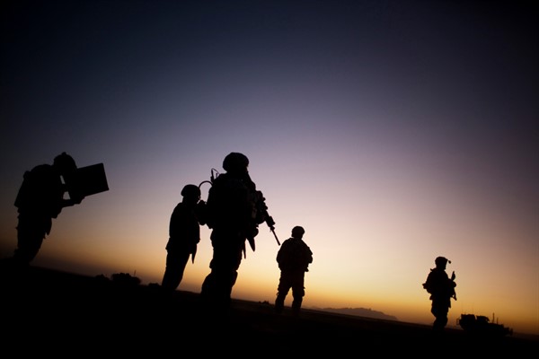 U.S. soldiers patrol on the outskirts of Spin Boldak, near the border with Pakistan, about 63 miles southeast of Kandahar, Afghanistan, Aug. 9, 2009 (AP photo by Emilio Morenatti).