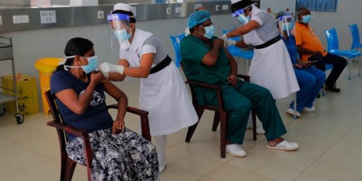 Nursing staff administer COVID-19 vaccines to frontline health workers in Colombo, Sri Lanka, Jan. 29, 2021 (AP photo by Eranga Jayawardena).