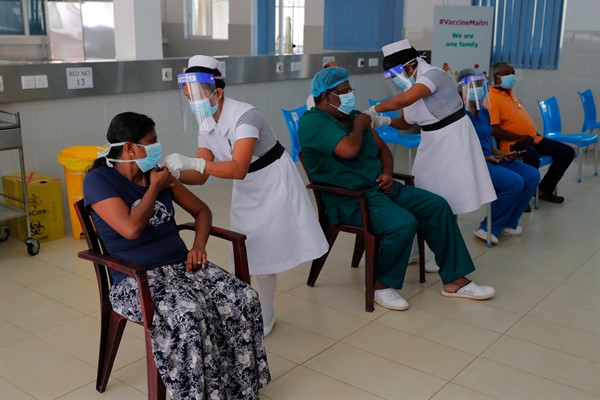 Nursing staff administer COVID-19 vaccines to frontline health workers in Colombo, Sri Lanka, Jan. 29, 2021 (AP photo by Eranga Jayawardena).