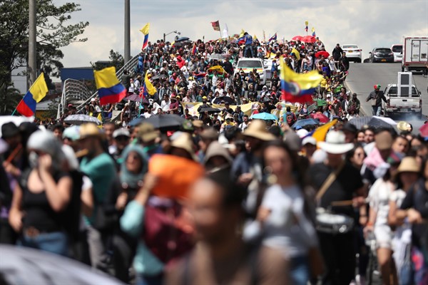 Anti-government demonstrators march during a national strike in Bogota, Colombia, Dec. 4, 2019 (AP photo by Fernando Vergara).