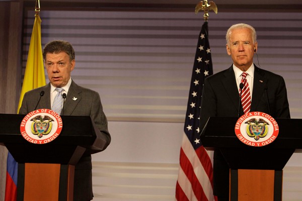 Then-Colombian President Juan Manuel Santos, left, and then-U.S. Vice President Joe Biden at the presidential palace in Bogota, Colombia, June 18, 2014 (AP photo by Javier Galeano).