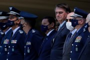 Brazilian President Jair Bolsonaro, fourth from right, flanked by Vice President Hamilton Mourao, left, and then-Defense Minister Fernando Azevedo, in Brasilia, Brazil, Jan. 20, 2021 (AP photo by Eraldo Peres).