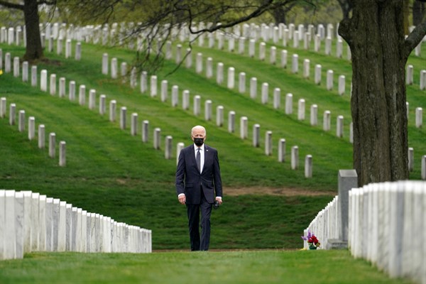 President Joe Biden visits Arlington National Cemetery after announcing the withdrawal of the remainder of U.S. troops from Afghanistan by Sept. 11, 2021, in Arlington, Va., April 14, 2021 (AP photo by Andrew Harnik).