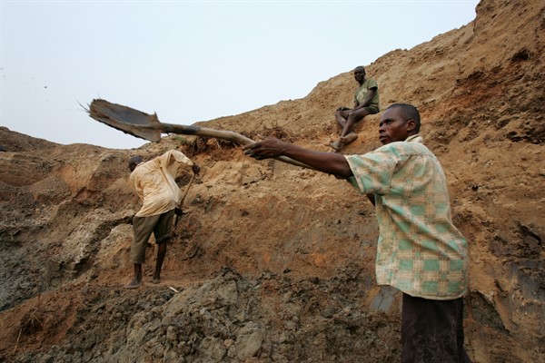 A diamond miner works in a mine in Mbuji Mayi, Congo, July 31, 2006 (AP photo by Schalk van Zuydam).