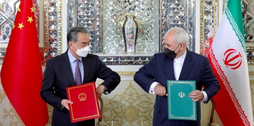 Iranian Foreign Minister Mohammad Javad Zarif, right, and his Chinese counterpart, Wang Yi, at a signing ceremony in Tehran, March 27, 2021 (AP photo by Ebrahim Noroozi).