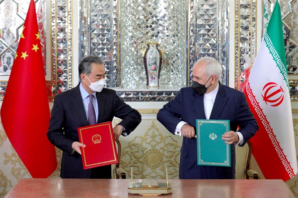 Iranian Foreign Minister Mohammad Javad Zarif, right, and his Chinese counterpart, Wang Yi, at a signing ceremony in Tehran, March 27, 2021 (AP photo by Ebrahim Noroozi).