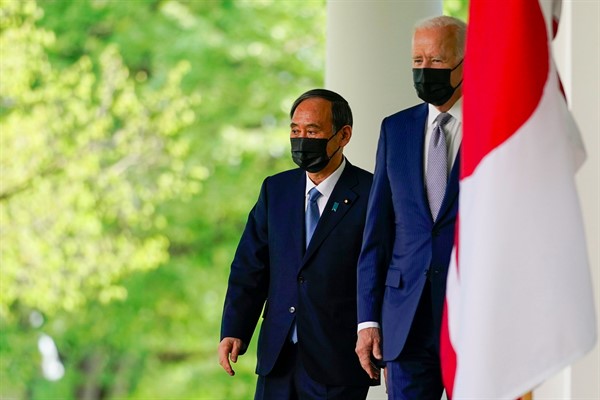 President Joe Biden and Japanese Prime Minister Suga Yoshihide walk from the Oval Office to speak at a news conference in the Rose Garden of the White House, April 16, 2021 (AP photo by Andrew Harnik).