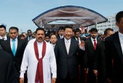 Sri Lankan President Mahinda Rajapaksa, in white, walks with Chinese President Xi Jinping after officially launching the Colombo Port City development, in Colombo, Sri Lanka, Sept. 17, 2014 (AP photo by Eranga Jayawardena).
