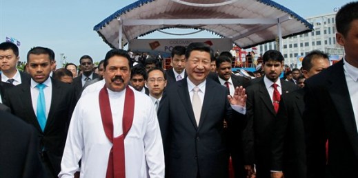 Sri Lankan President Mahinda Rajapaksa, in white, walks with Chinese President Xi Jinping after officially launching the Colombo Port City development, in Colombo, Sri Lanka, Sept. 17, 2014 (AP photo by Eranga Jayawardena).