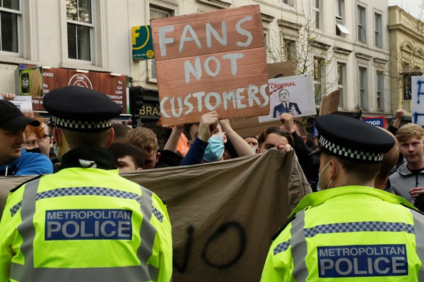 Chelsea fans protest outside Stamford Bridge stadium in London, against Chelsea’s decision to be included among the clubs attempting to form a new European Super League, April 20, 2021 (AP photo by Matt Dunham).