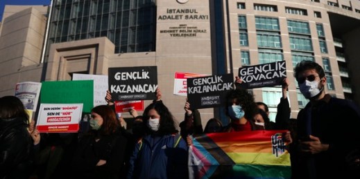 Bogazici University students hold an LGBT flag and a placard that reads “the youth will win” at a protest in support of their detained friends in Istanbul, Feb. 3, 2021 (AP photo by Emrah Gurel).