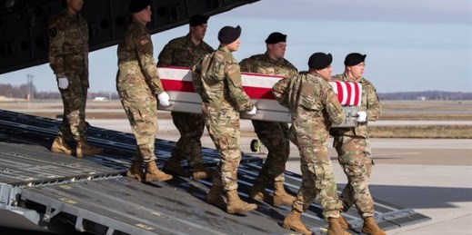 A U.S. Army carry team transports the remains of a Special Forces soldier who died in Afghanistan, at Dover Air Force Base, Delaware, Dec. 25, 2019 (AP photo by Alex Brandon).