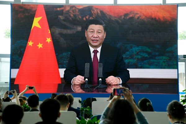 A press center in China’s southern island province of Hainan shows Xi Jinping giving an online speech at the Boao Forum for Asia, April 20, 2021 (Kyodo photo via AP Images).