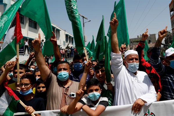 Hamas supporters protest against Palestinian President Mahmoud Abbas’ decision to postpone Palestinian elections, in Jebaliya refugee camp, Gaza Strip, April 30, 2021 (AP photo by Adel Hana).