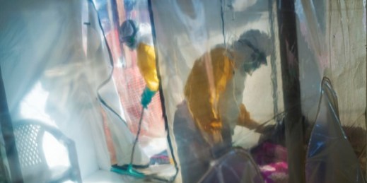 Health workers tend to an Ebola victim kept in an isolation cube in Beni, Congo, July 13, 2019 (AP photo by Jerome Delay).