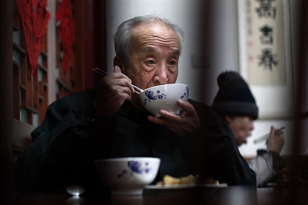 Elderly people have their lunch at a government-funded nursing home in Beijing, March 19, 2010 (AP photo by Andy Wong).