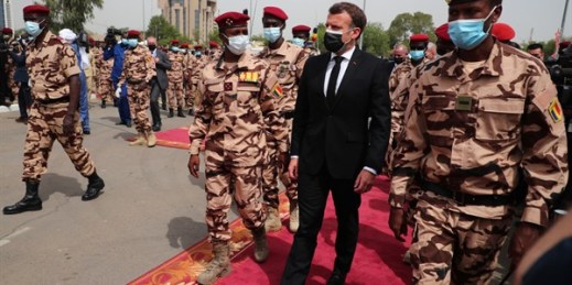 French President Emmanuel Macron, center, attends the state funeral for the late Chadian President Idriss Deby, with Deby’s son, Mahamat Idriss Deby, in N’Djamena, Chad, April 23, 2021 (pool photo by Christophe Petit Tesson via AP).