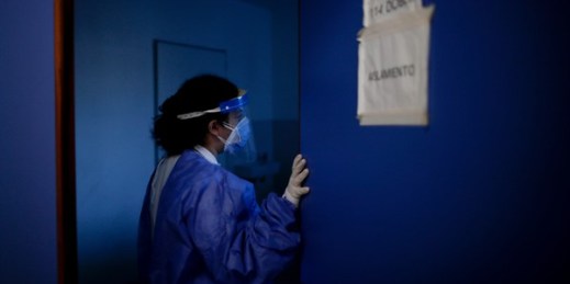 A doctor checks on COVID-19 patients at Llavallol Dr. Norberto Raúl Piacentini Hospital in Lomas de Zamora, Argentina, May 8, 2021 (AP photo by Natacha Pisarenko).