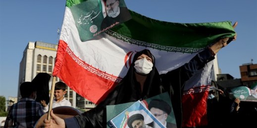 A supporter of presidential candidate Ebrahim Raisi during a rally in Tehran, Iran, June 14, 2021 (AP photo by Ebrahim Noroozi).