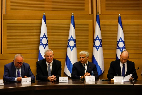 From the left, Avigdor Lieberman, Benny Gantz, Yair Lapid and Israel’s new prime minister, Naftali Bennett, hold a first Cabinet meeting, in Jerusalem, June 13, 2021 (AP photo by Ariel Schalit).