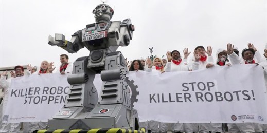 Protesters take part in a Campaign to Ban Killer Robots demonstration in front of the Brandenburg Gate, in Berlin, Germany, March 21, 2019 (Photo by Wolfgang Kumm for dpa via AP Images).