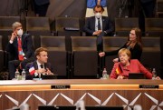 French President Emmanuel Macron and German Chancellor Angela Merkel during a plenary session at the NATO summit in Brussels, June 14, 2021 (AP photo by Olivier Matthys).