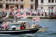 Activists stage a protest against a cruise ship docking in Venice, Italy, June 5, 2021 (AP photo by Antonio Calanni).